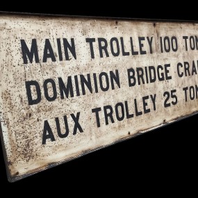 Metal sign of industrial overhead crane belonging to the Dominion Bridge Company