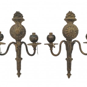 Pair of antique two-arm wall sconces featuring ornate classical detailing.