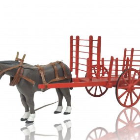 Folk art horse sculpture with hay wagon