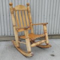 Handcrafted solid wood rocking chair with warm rustic appeal. - 4