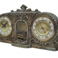 Vintage clock and barometer set in an ornate metal case. - 1