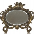 Miroir sur pied décoré de chérubins - 1
