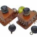 Pair of antique wooden wall telephones with bells and receivers. - 2